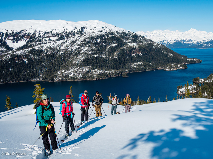 Guided Ski Group enjoying a perfect 'bluebird' day in Prince William Sound. Photo by: Nick D'Alessio
