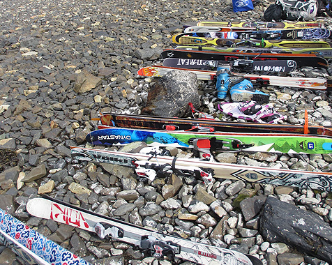 Skis stacked up and ready to go backcountry skiing in Prince William Sound Alaska