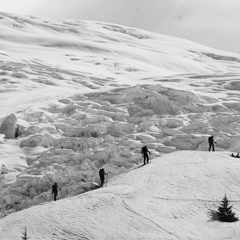 Skinning up the backcountry mountains on a guided backcountry ski trip in Prince William Sound 